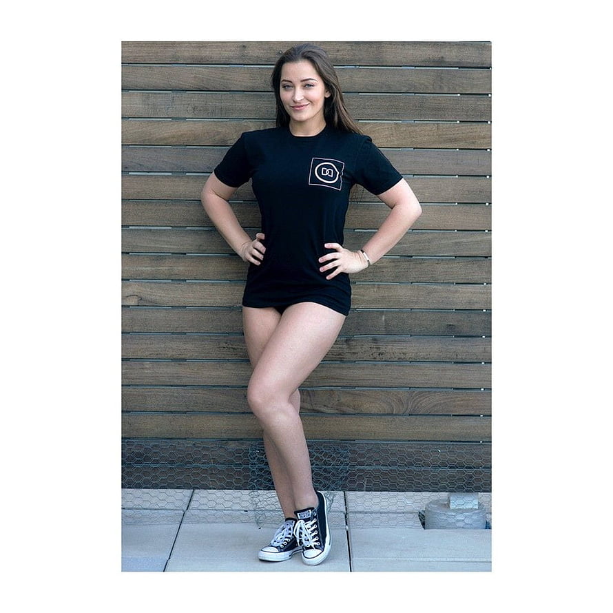 Woman in Oversized Black T-Shirt and Sneakers Posing Against Wooden Wall, Pin on Dani daniels, danny daniel HD phone wallpaper