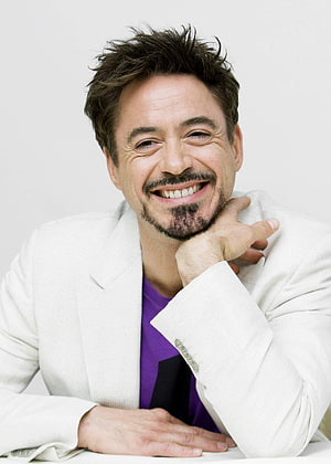 Robert Downey Jr smiling portrait in white blazer and purple shirt HD phone wallpaper