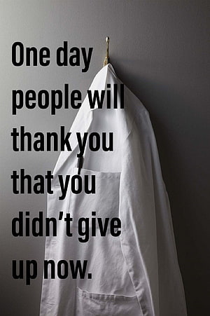 White Doctor Coat Hanging on Wall with Motivational Quote About Perseverance HD phone wallpaper