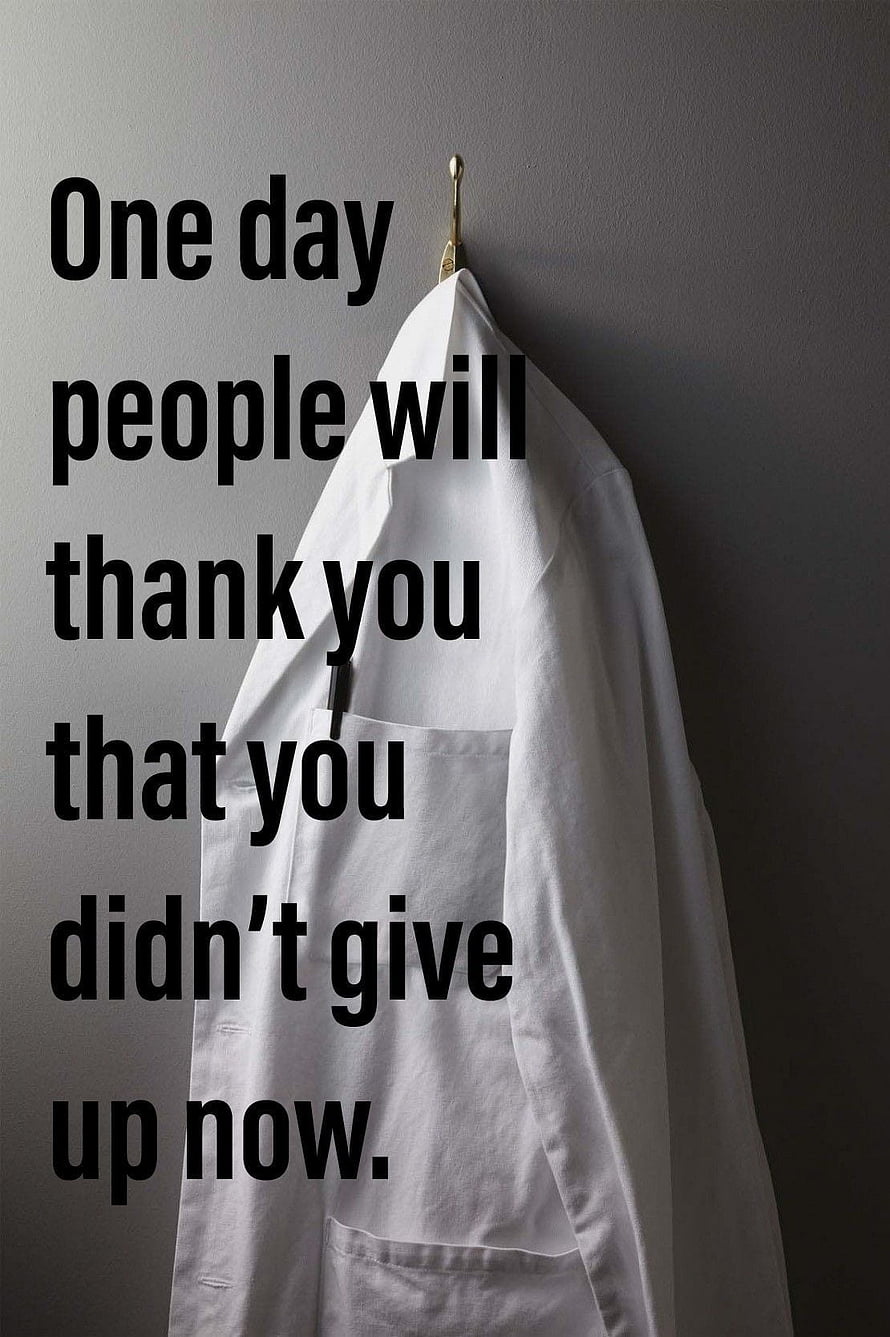 White Doctor Coat Hanging on Wall with Motivational Quote About Perseverance HD phone wallpaper