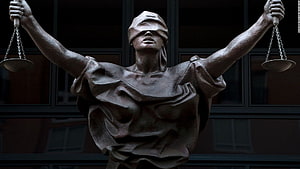 Bronze Statue of Lady Justice Holding Scales of Justice HD wallpaper
