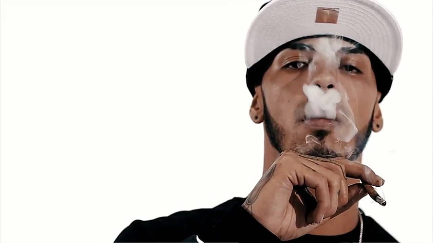 Portrait of a man exhaling smoke while holding a cigarette against a white background, Anuel AA HD wallpaper