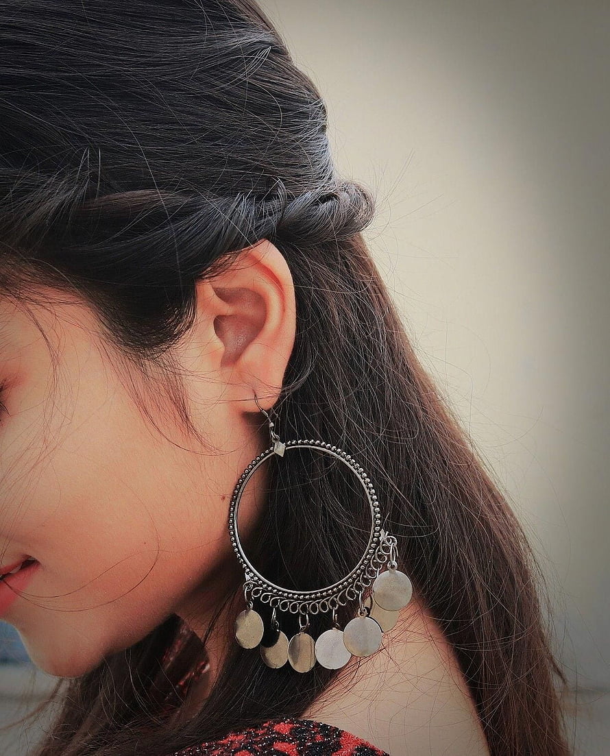 Close-up of a woman wearing large silver hoop earrings with dangling coin charms and dark hair, Dp For Whatsapp Profile For Girl, girl mobile hidden face HD phone wallpaper