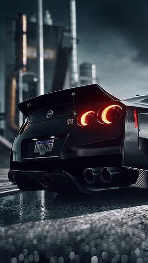 Nissan GT-R Rear View with Glowing Taillights on Wet Asphalt at Night HD phone wallpaper