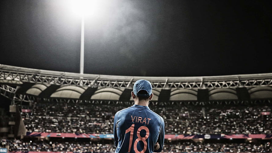 Virat Kohli Cricket Player Standing In Stadium Under Floodlights HD wallpaper
