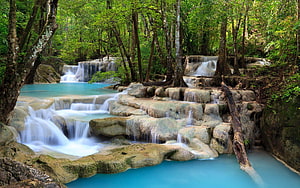 Turquoise Waterfall Cascading Through Lush Tropical Forest HD wallpaper