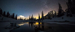 Winter Night Sky Over Snowy Mountain Lake With Starry Reflection HD wallpaper