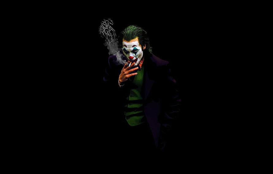 Joaquin Phoenix as The Joker in a dark cinematic portrait smoking a cigarette HD wallpaper