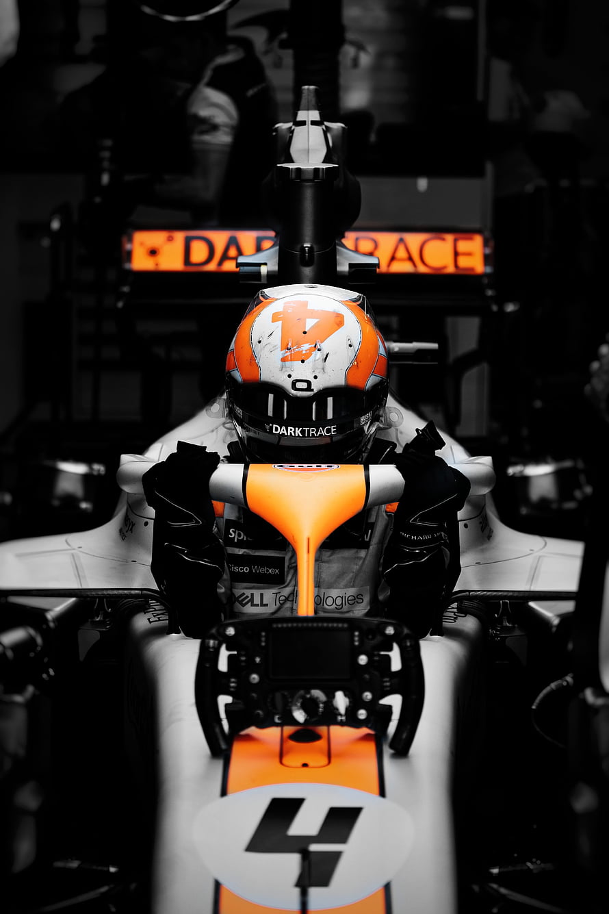 Lando Norris in McLaren Formula 1 Car with Orange and White Livery HD phone wallpaper