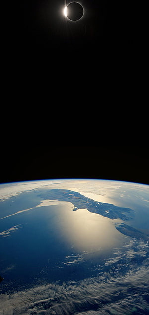 Total Solar Eclipse Over Earth From Space With Dramatic Corona and Ocean View HD phone wallpaper