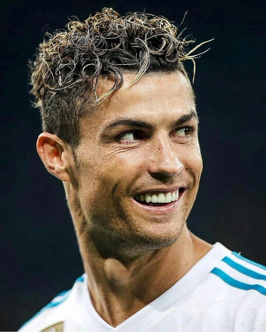 Cristiano Ronaldo smiling in white jersey with blue stripes HD phone wallpaper