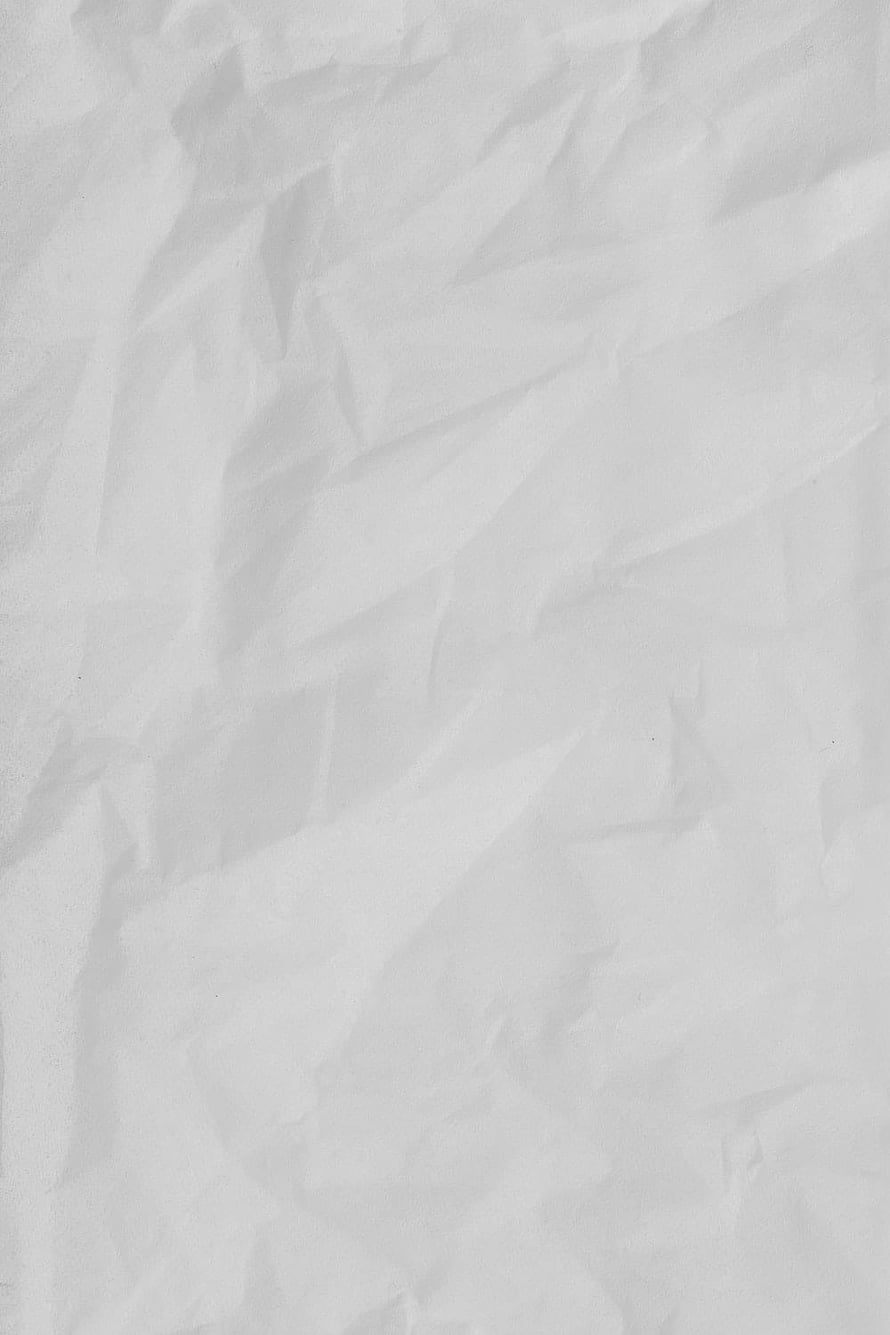 Crumpled White Paper Texture with Soft Folds and Subtle Shadows HD phone wallpaper