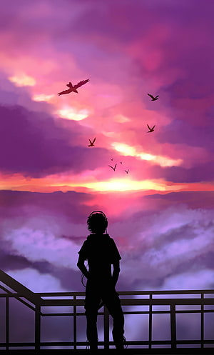 Silhouette of a boy with headphones watching a vibrant sunset over clouds and birds HD phone wallpaper