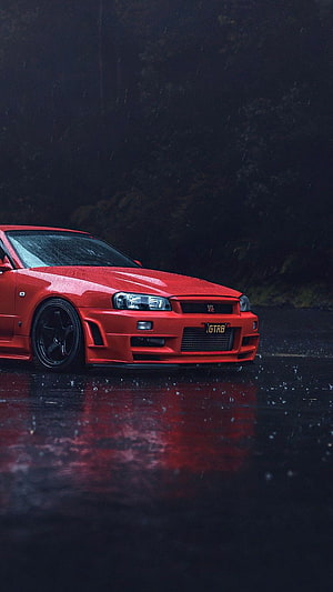 Red Nissan Skyline GT-R R34 in Rainy Night Atmosphere HD phone wallpaper