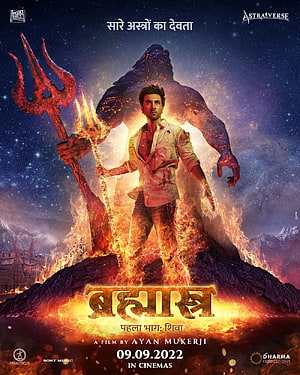 Brahmastra Part One: Shiva movie poster featuring Ranbir Kapoor with trident and fiery giant HD phone wallpaper