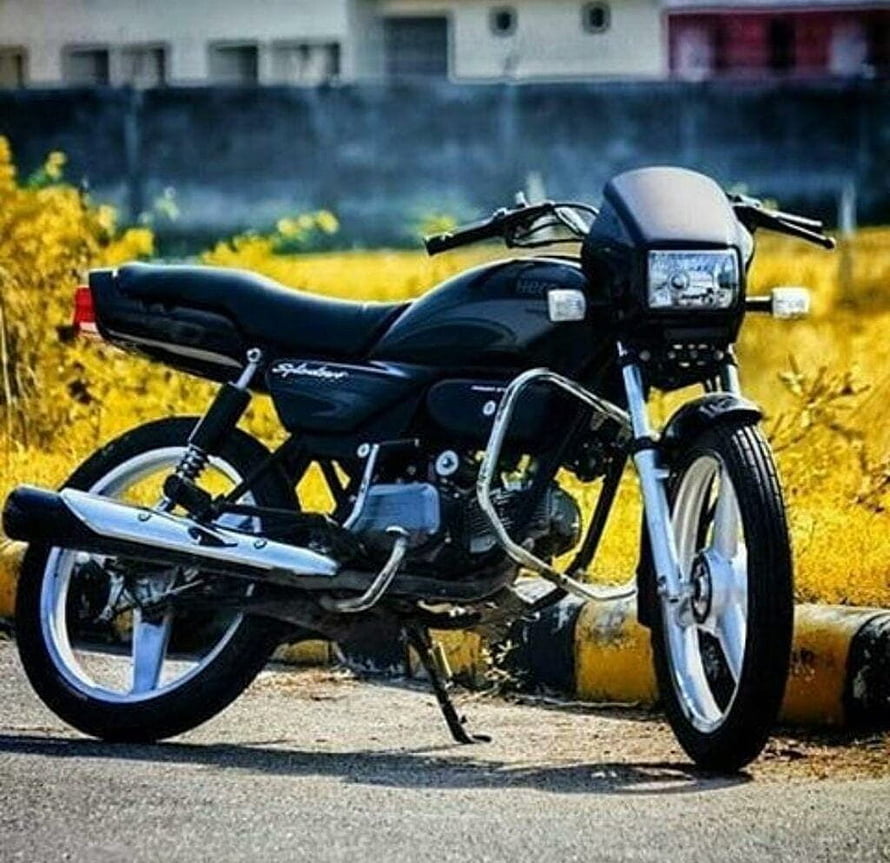 Black Splendor Motorcycle Parked on Road with Yellow Flowers HD wallpaper