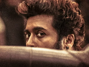 Suriya Intense Close-Up Portrait With Curly Hair And Earring HD wallpaper
